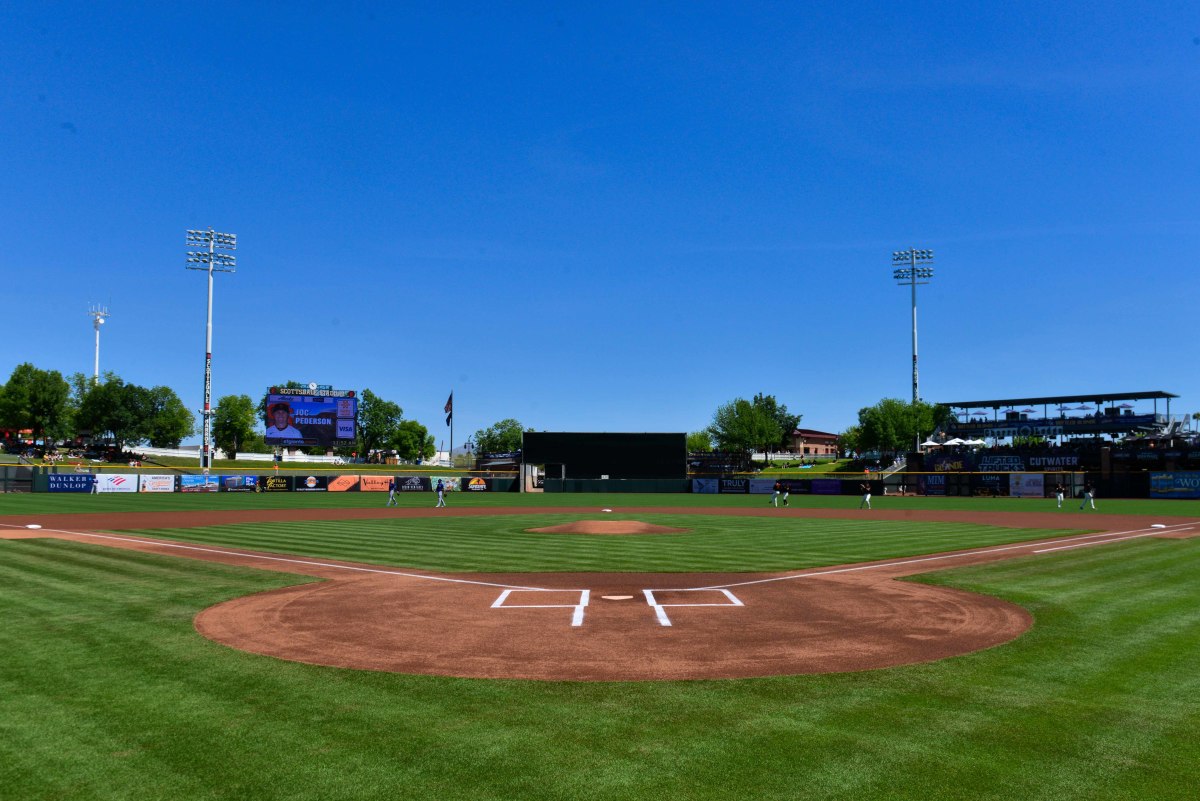 The SF Giants and Texas Rangers warm up before a game at Scottsdale Stadium. (2022)